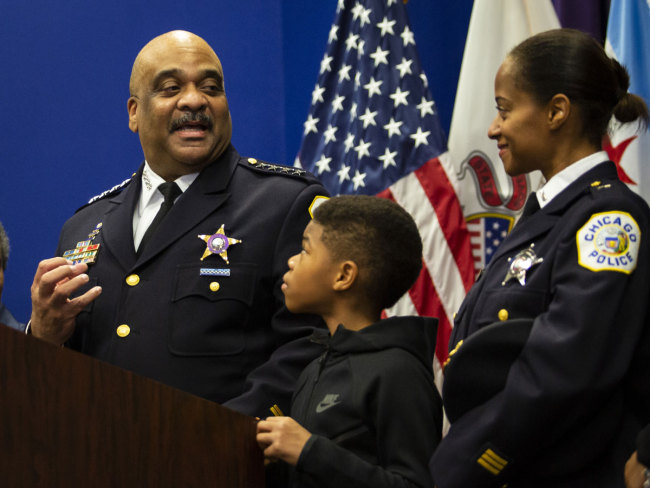 hicago Police Department Supt. Eddie Johnson looks back at his wife and 10-year-old son as he announces his retirement during a press conference at CPD headquarters, Thursday morning, Nov. 7, 2019. [Photo: AP]