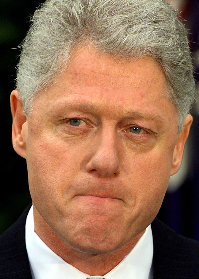 US President Bill Clinton pauses while reading a statement in the Rose Garden of the White House after the Senate voted not to impeach him February 12, 1999 in Washington, DC. Clinton apologized for the actions that led to his impeachment and subsequent acquittal by the Senate, saying he was "profoundly sorry." [File photo: AFP/Stephen Jaffe]