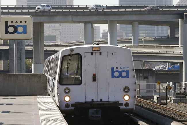 In this Oct. 15, 2013, file photo, a Bay Area Rapid Transit train departs the MacArthur station in Oakland, Calif. [Photo: AP]