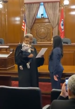 Judge Richard Dinkins held law student Juliana Lamar's baby so that the boy could be part of his mother's swearing-in ceremony at the Tennessee Supreme Court in Nashville on November 9, 2019. [Photo: @sarahfor5]