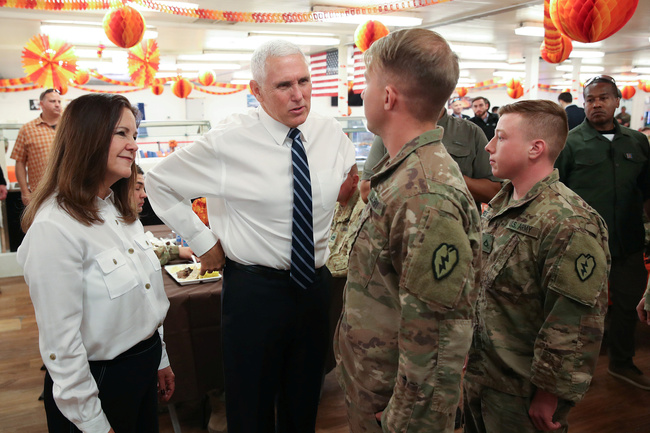 U.S. Vice President Mike Pence and his wife Karen Pence chat with the soldiers in a dining facility at Camp Flores on Al Asad Air Base, Iraq November 23, 2019.[Photo: VCG]