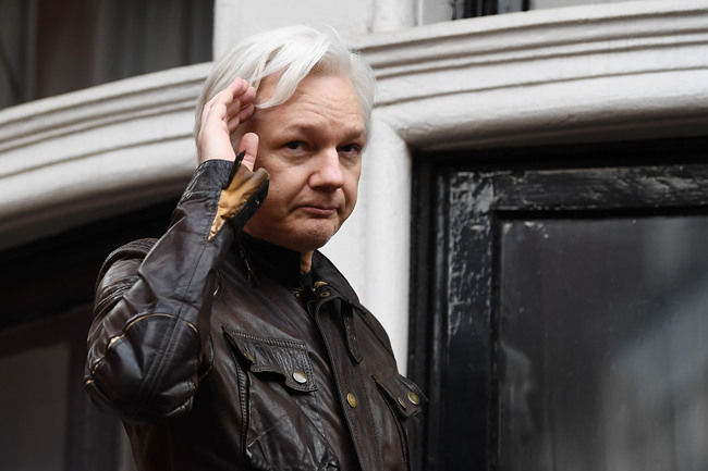 In this file photo taken on May 19, 2017 Wikileaks founder Julian Assange speaks on the balcony of the Embassy of Ecuador in London. More than 60 doctors wrote an open letter published November 25, 2019, saying they feared Julian Assange's health was so bad that the WikiLeaks founder could die inside a top-security British jail.[Photo: Justin TALLIS/AFP]