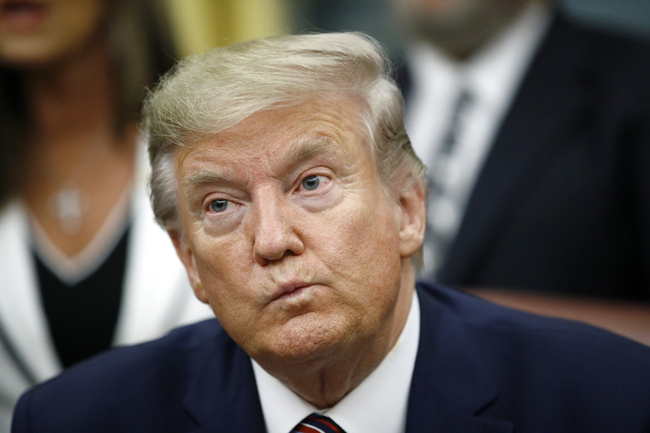 President Donald Trump participates in a bill signing ceremony for the Preventing Animal Cruelty and Torture Act in the Oval Office of the White House, Nov. 25, 2019, in Washington. [Photo: AP]