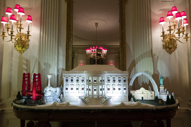 The White House made of gingerbread also features landmarks from around the country in the State Dinning Room during the 2019 Christmas preview at the White House, Monday, Dec. 2, 2019, in Washington. [Photo: AP/Alex Brandon]