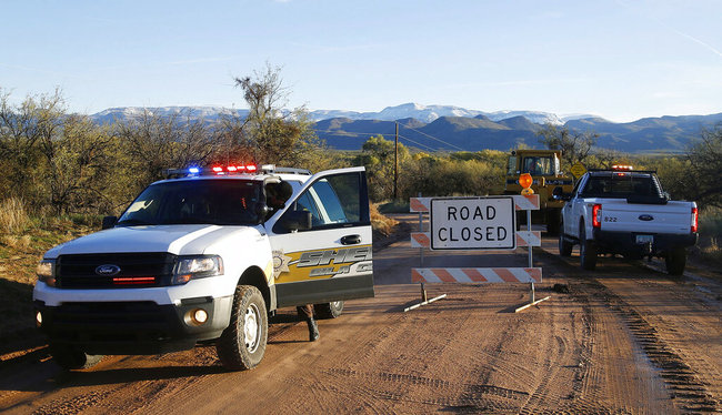 This Saturday, Nov. 30, 2019, photo shows the road closed near Bar X road and Tonto Creek after a vehicle was washed by flood waters in Tonto Basin, Ariz. [Photo: AP]