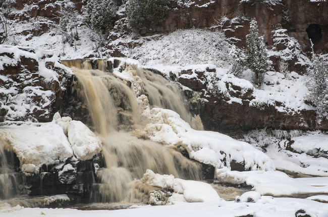 Snow fell on the pristine Gooseberry Falls State Park on November 27, 2019, Minnesota. [Photo: VCG]