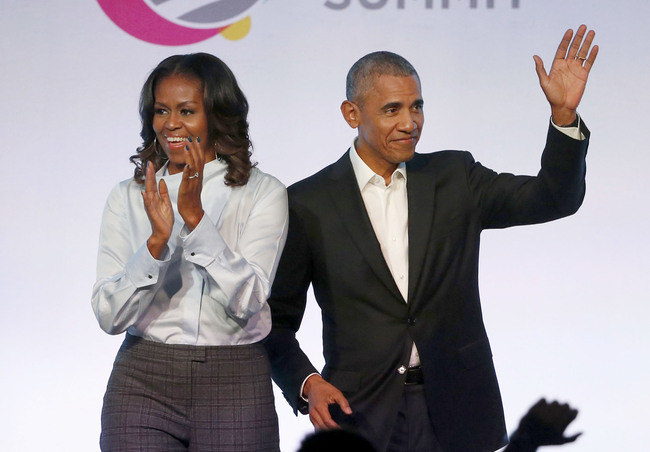 In this Oct. 31, 2017, file photo, former President Barack Obama, right, and former first lady Michelle Obama appear at the Obama Foundation Summit in Chicago. [Photo: AP]