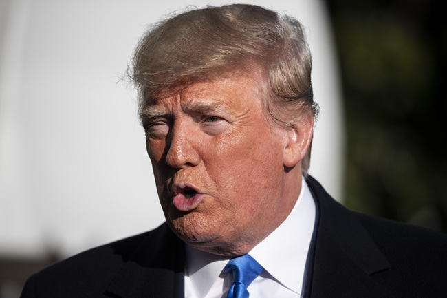 U.S. President Donald Trump speaks with reporters before boarding Marine One on the South Lawn of the White House, Saturday, Dec. 7, 2019, in Washington. [Photo: AP/Alex Brandon]