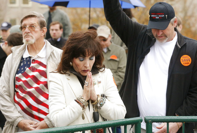 Samm Tittle, of Fredericksburg, Va., prays during a gun rights rally at the State Capitol in Richmond, Va., on Monday, Dec. 9, 2019. [Photo: AP]