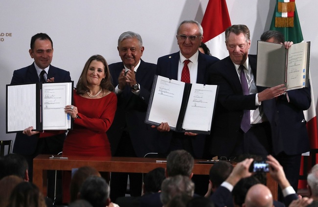 House Speaker Nancy Pelosi of Calif., accompanied by House Congress members, speaks at a news conference to discuss the United States Mexico Canada Agreement (USMCA) trade agreement, Tuesday, Dec. 10, 2019, on Capitol Hill in Washington. [Photo: AP/Andrew Harnik]