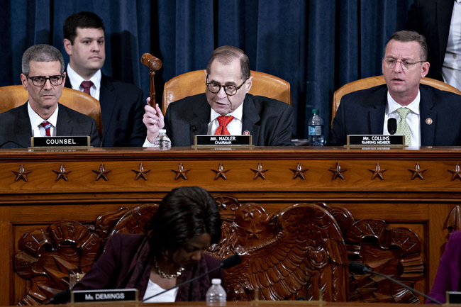 Representative Jerry Nadler, a Democrat from New York and chairman of the House Judiciary Committee, second left, gavels out after announcing a recess as ranking member Representative Doug Collins, a Republican from Georgia, right, listens during a hearing in Washington, D.C., U.S., on December 12, 2019. [Photo: AFP]