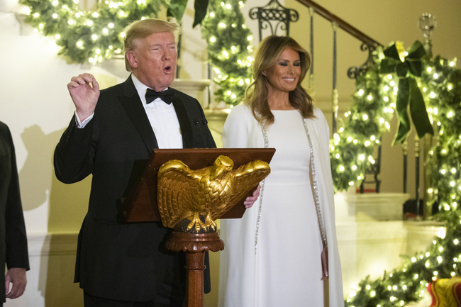 President Donald Trump with first lady Melania Trump speaks at the Grand Foyer of the White House during the Congressional Ball, Thursday, Dec. 12, 2019, in Washington. [Photo: AP/Manuel Balce Ceneta]