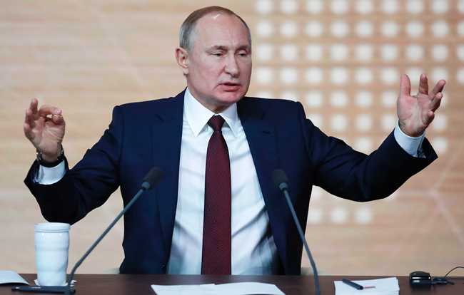 Russian President Vladimir Putin gestures during his annual news conference in Moscow, Russia, Thursday, Dec. 19, 2019. [Photo: AP/Pavel Golovkin]