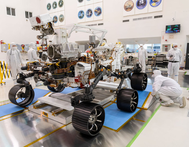 In a clean room at NASA's Jet Propulsion Laboratory in Pasadena, California, engineers observe the first driving test for NASA's Mars 2020 rover on Dec. 17, 2019. [Photo: nasa.gov/JPL-Caltech]