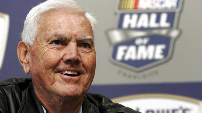 In this Oct. 16, 2009, file photo, former NASCAR driver and owner Junior Johnson smiles as he speaks to media about being named to the NASCAR Hall of Fame during a news conference at Lowe's Motor Speedway in Concord, N.C. [File Photo: AP/Bob Jordan]