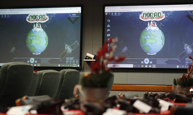 Monitors are illuminated in the NORAD Tracks Santa center at Peterson Air Force Base, Monday, Dec. 23, 2019, in Colorado Springs, Colo. [Photo: AP]