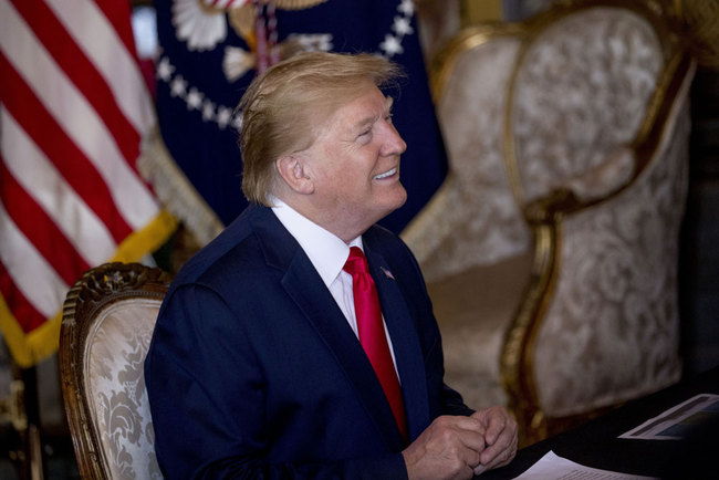 President Donald Trump speaks during a Christmas Eve video teleconference with members of the military at his Mar-a-Lago estate in Palm Beach, Fla., Tuesday, Dec. 24, 2019. [Photo: AP/Andrew Harnik]