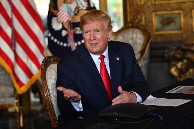 US President Donald Trump answers questions from reporters after making a video call to the troops stationed worldwide at the Mar-a-Lago estate in Palm Beach Florida, on December 24, 2019. [Photo: AFP]