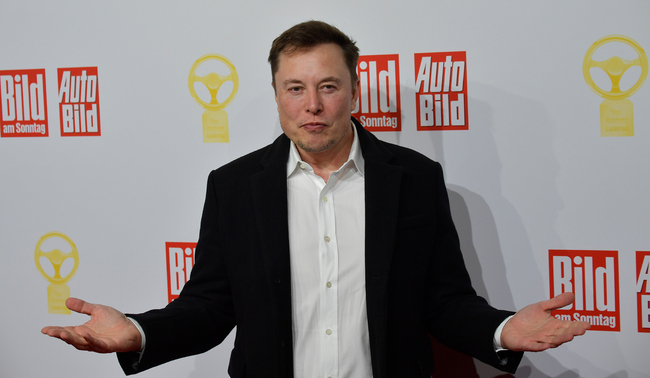 Elon Musk, CEO of Tesla and SpaceX, poses on the red carpet as he arrives for the 43rd "Goldenes Lenkrad" (Golden Steering Wheel) awards on November 12, 2019 in Berlin. [Photo: Tobias SCHWARZ/AFP]