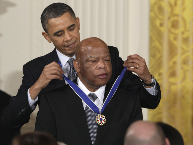 In this Feb. 15, 2011, file photo, President Barack Obama presents a 2010 Presidential Medal of Freedom to Rep. John Lewis, D-Ga., during a ceremony in the East Room of the White House in Washington. [Photo: AP]<br>