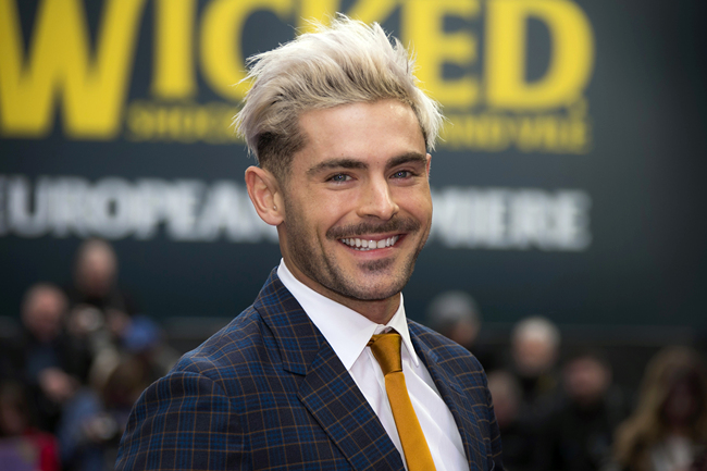 In this Wednesday, April 24, 2019, file photo, actor Zac Efron poses for photographers upon arrival at a premiere in London. [Photo: AP]