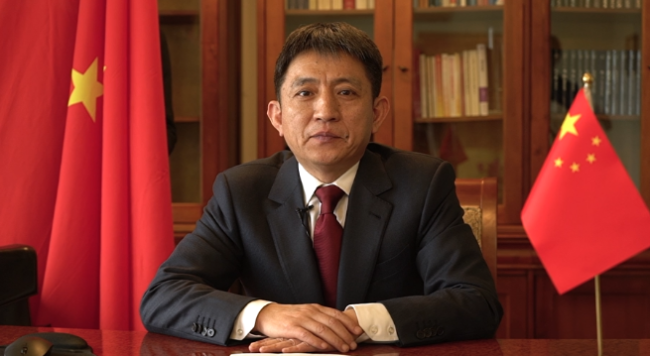 Na snímku je čínský zástupce a velvyslanec ve Světové obchodní organizaci (WTO) Li Chenggang (Li Čcheng-kang). Fotografie: China Media Group (CMG)