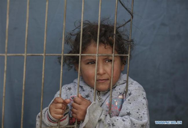  Enfant réfugié palestinien au camp de réfugiés d'al-Shati dans la ville de Gaza, le 17 janvier 2018. L'Office de secours et de travaux des Nations unies pour les réfugiés de Palestine (UNRWA) a annoncé mercredi avoir lancé une campagne de financement communautaire après que les Etats-Unis ont réduit de plus de 50% leur aide à l'office. (Photo : Wissam Nassar)