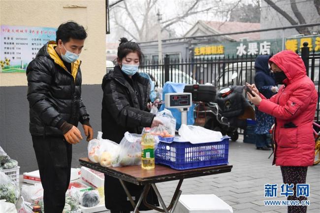 Beijing : un service de livraison de nourriture à domicile du quartier répond au besoin des habitants